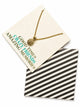 Lovisa friendship card and necklace set with black and white lined envelope.
