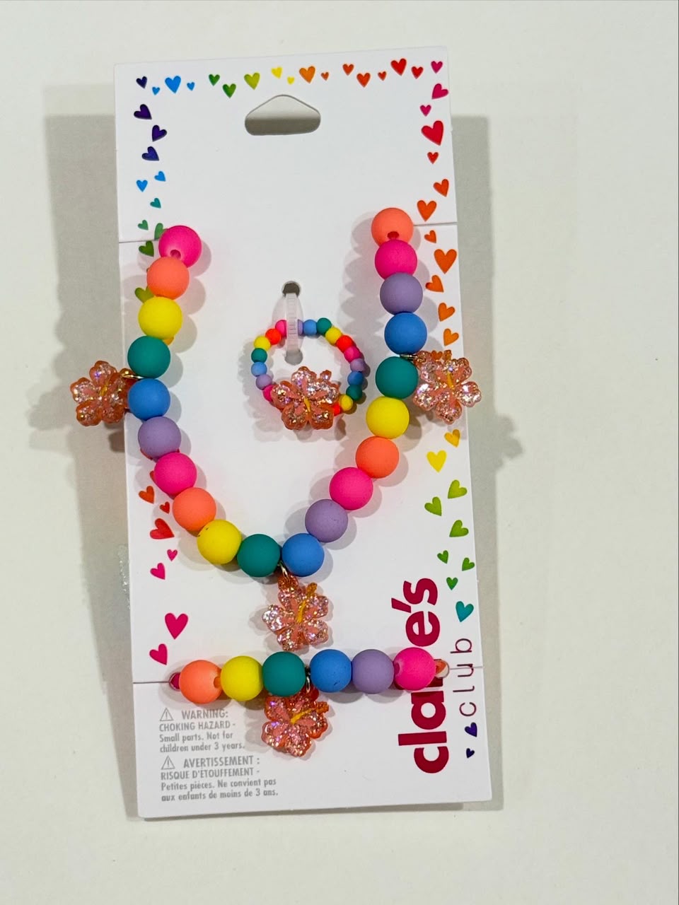 Claire’s beaded multi bracelet necklace and ring set with hanging flower charms
