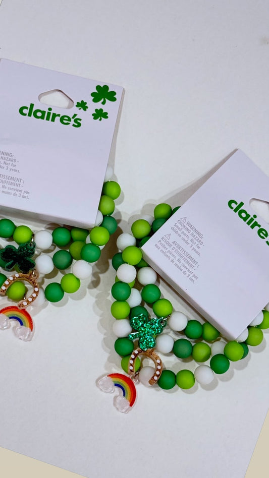 Claire’s green and white good luck charm bracelet set with rainbow horseshoe and shamrock charm