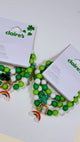 Claire’s green and white good luck charm bracelet set with rainbow horseshoe and shamrock charm