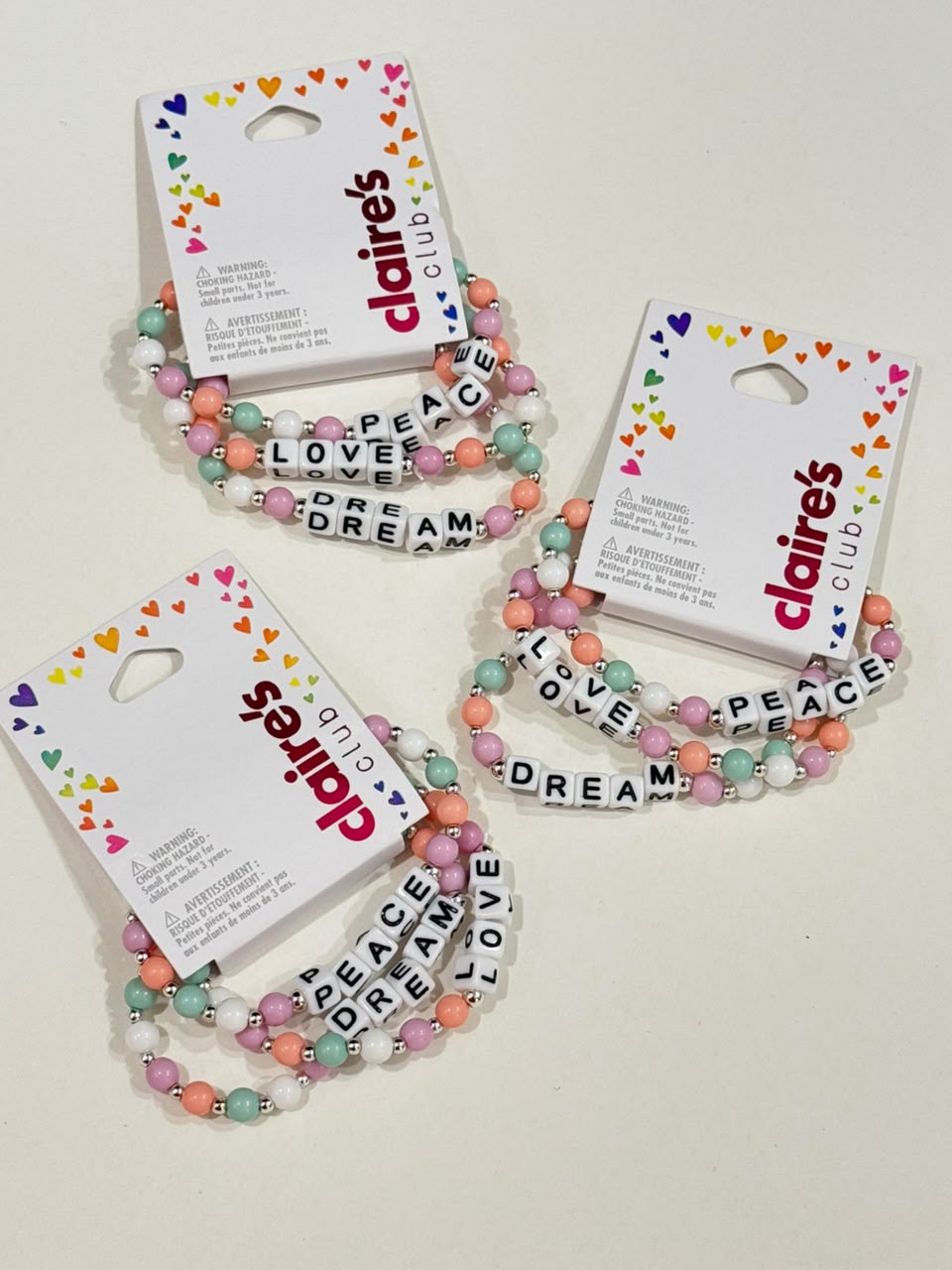 Claire’s pastel beaded pack of 3 peace dream and love adjustable bracelet