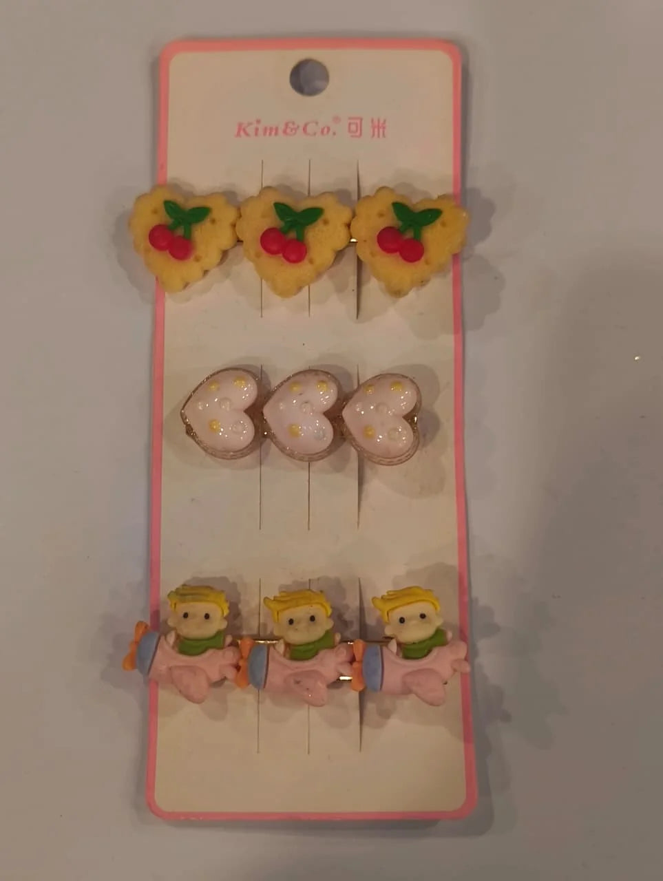 Set of hair clips on a 'Kim & Co.' branded card